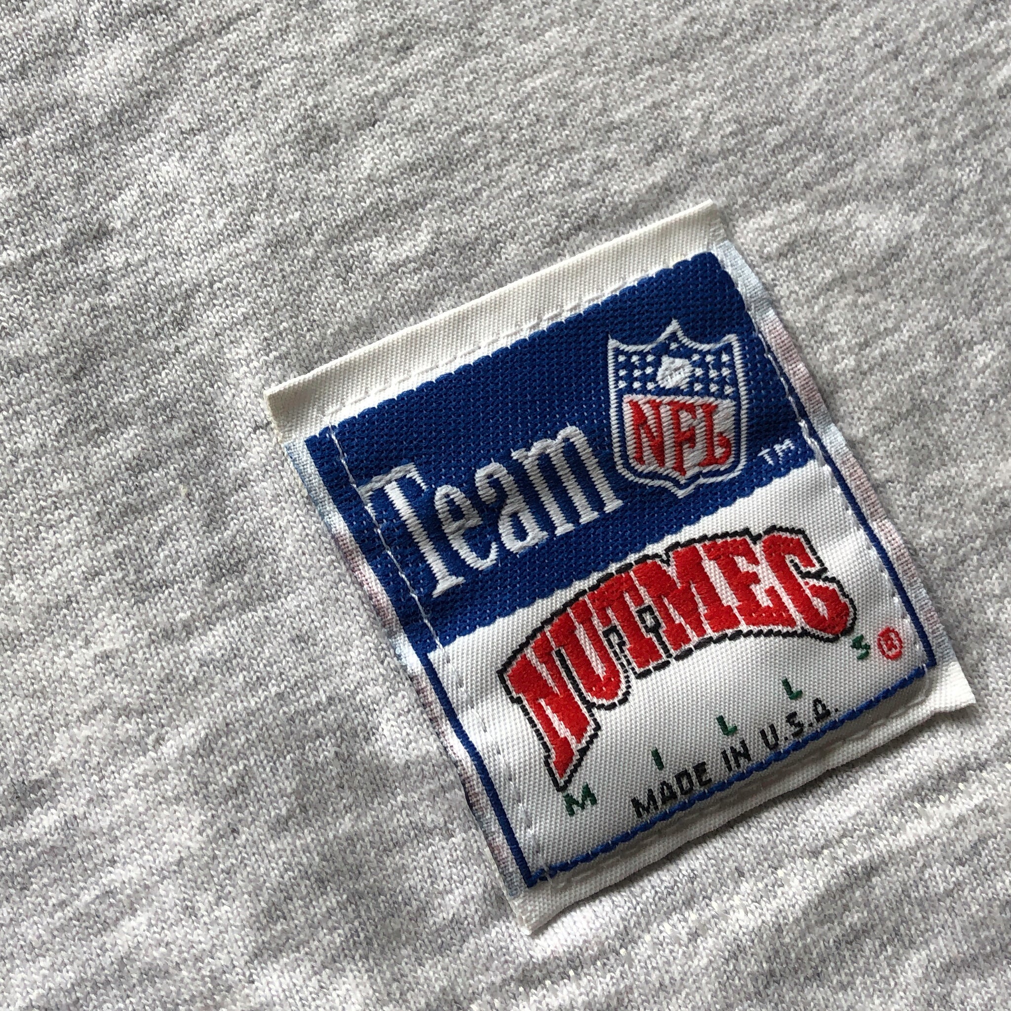 WESTSIDE STOREY VINTAGE | VINTAGE 90'S NUTMEG NFL PLAID PATCH CHIEFS ASH GREY T-SHIRT - Westside Storey